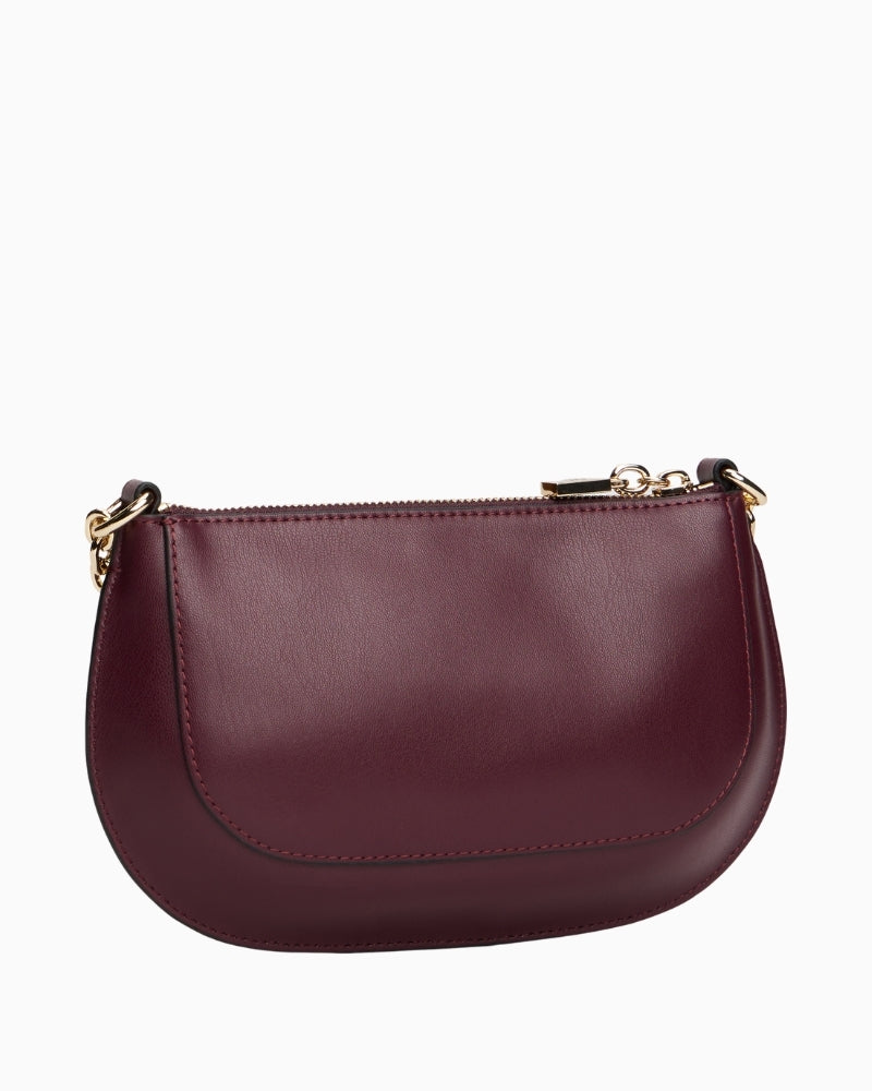 Back view of compact crossbody bag in rich wine red