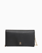 Tommy Hilfiger black flap bag with gold chain strap and logo detailing