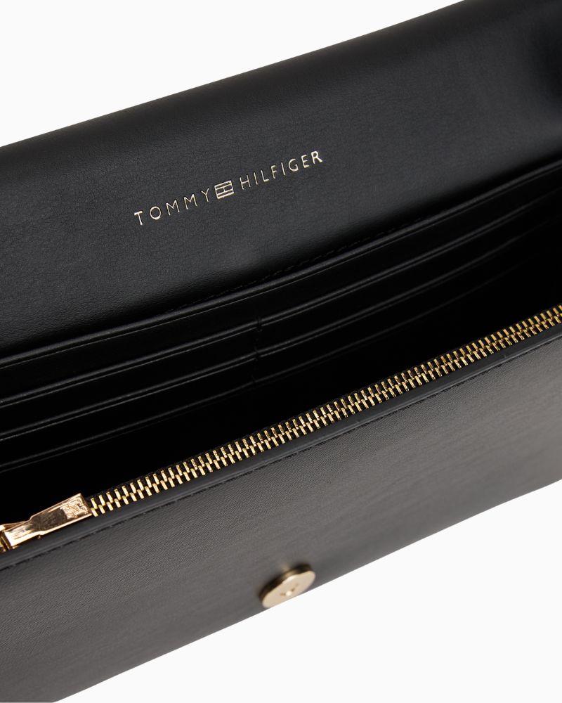 Close up view of TH Icon chain bag in faux leather showing flap closure and structured shape
