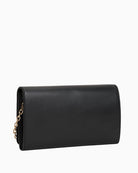 Back view of TH Icon chain bag in faux leather showing flap closure and structured shape