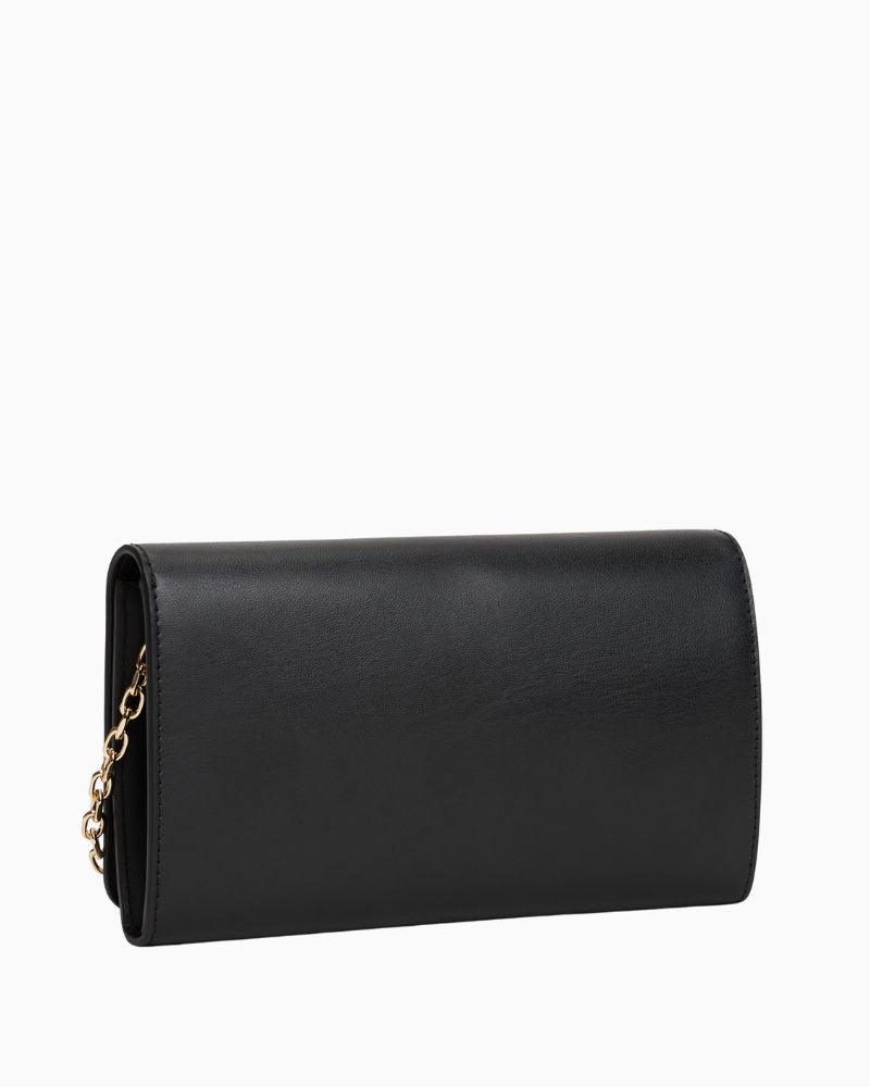 Back view of TH Icon chain bag in faux leather showing flap closure and structured shape