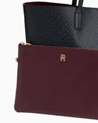 Close-up of faux leather texture and signature TH print in blue