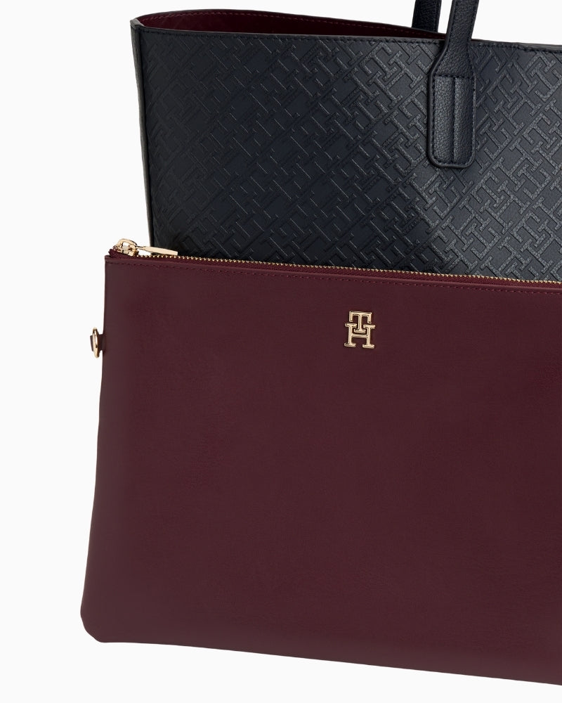 Close-up of faux leather texture and signature TH print in blue