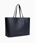 Back view of TH monogram tote with twin handles and structured shape