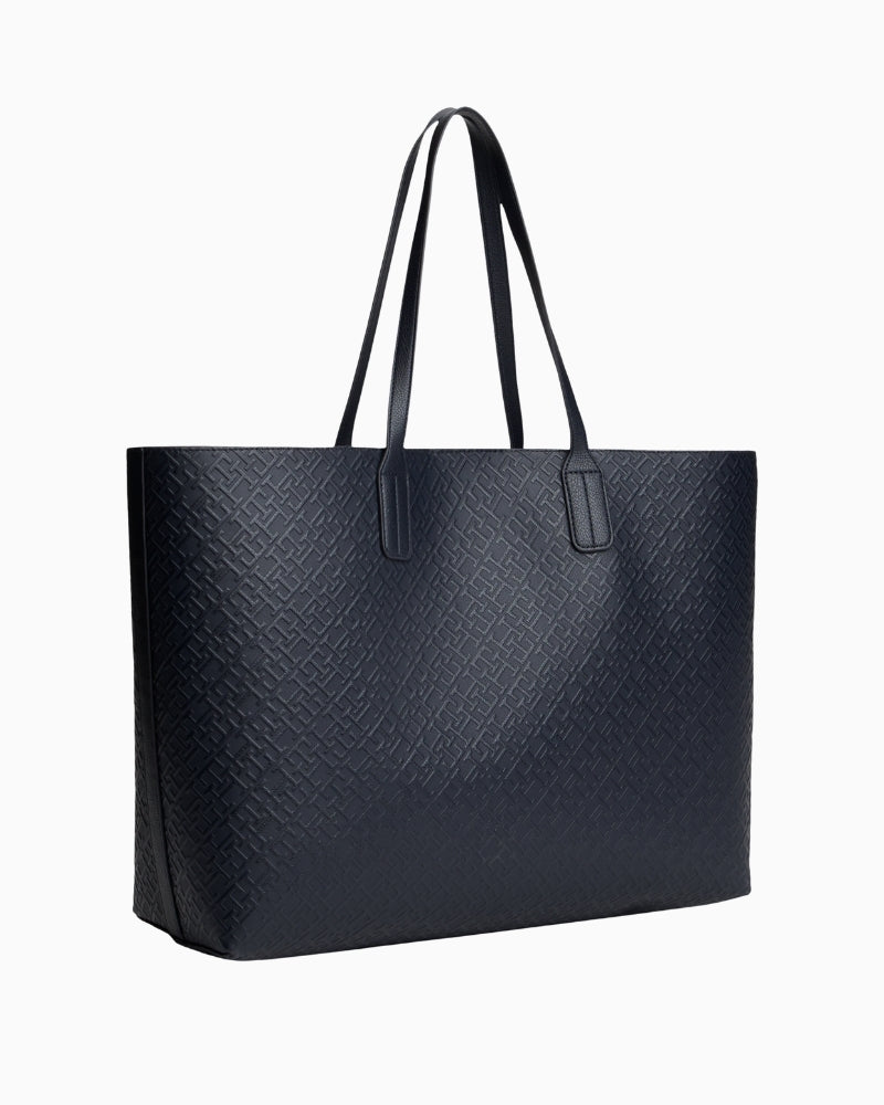 Back view of TH monogram tote with twin handles and structured shape