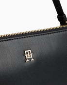 Compact pouch in black with detachable strap and smooth finish