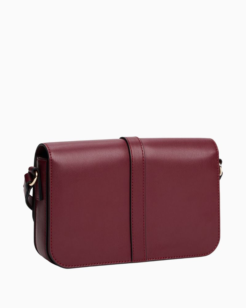 Back view of Tommy Hilfiger compact crossbody in structured red finish with flap closure