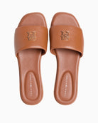 Tan Tommy Hilfiger mule top view with logo hardware detail – Áines Boutique