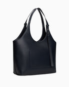 Side view of spacious faux leather tote with twin handles