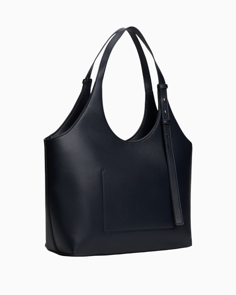 Side view of spacious faux leather tote with twin handles