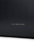 Closeup view of spacious faux leather tote with twin handles