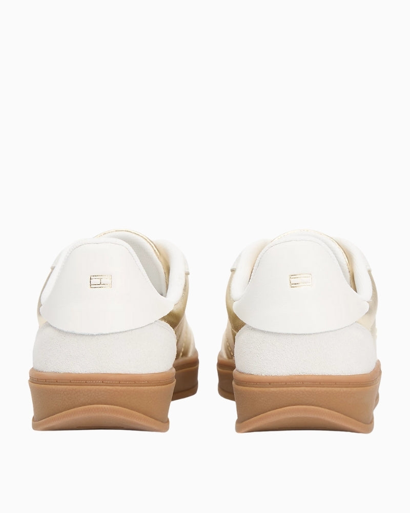 Back view of trainers with metallic flag detail on heel