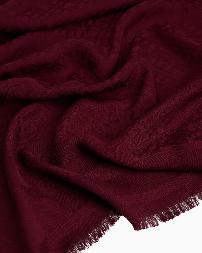 Close-up of Tommy scarf showing soft fabric and tonal monogram print