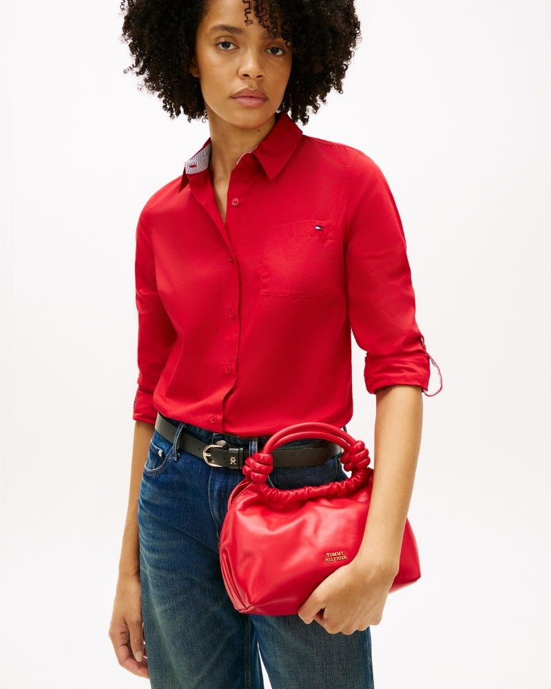 Woman wearing Tommy Hilfiger soft leather medium crossover red – Áines Boutique