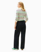Back view of tailored wool trousers with clean lines