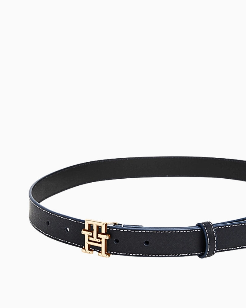 Full view of black Tommy Hilfiger belt fastened with gold 'H' buckle 
