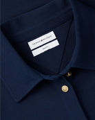 Tommy Hilfiger 1985 Gold-Tone Button Shirt in Navy cotton piqué texture close-up