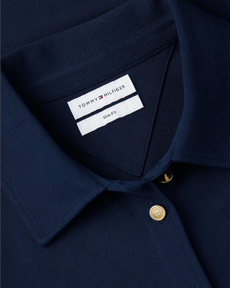 Tommy Hilfiger 1985 Gold-Tone Button Shirt in Navy cotton piqué texture close-up