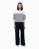 Tommy Hilfiger Gold Button Polo Sweatshirt in ecru navy front view