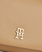 Close up view of Tommy Hilfiger Mini Crossover with logo detail 