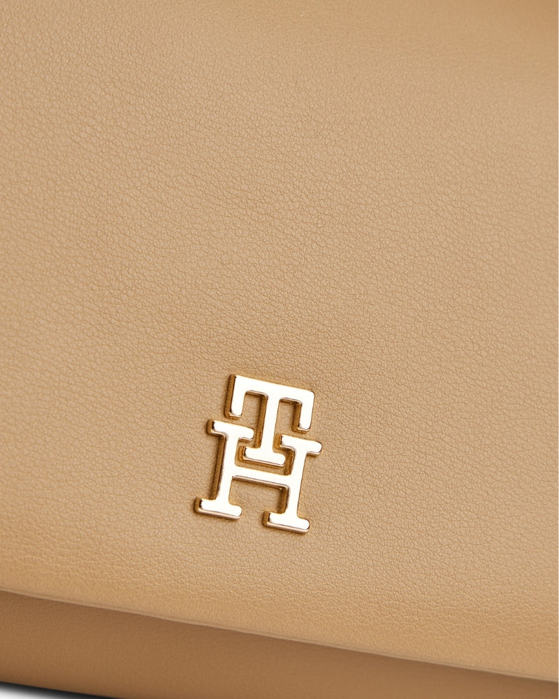 Close up view of Tommy Hilfiger Mini Crossover with logo detail 
