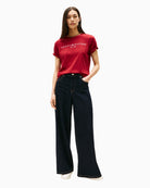 Styled outfit featuring red Tommy tee