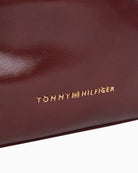 Tommy Hilfiger TH Modern Chain Clutch Patent in Burgundy patent-style finish close-up