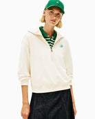 Woman wearing Tommy Hilfiger terry half-zip jumper in cream, front view – Áines Boutique
