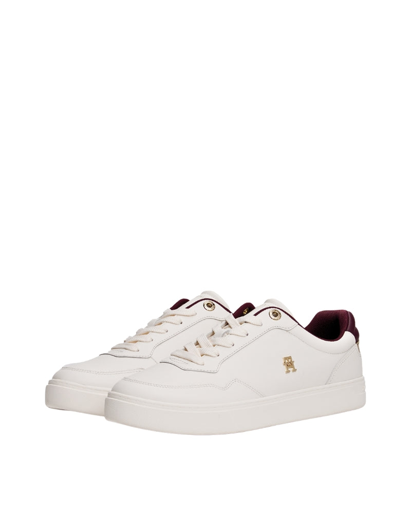Angled front view of the white leather Tommy Hilfiger trainer