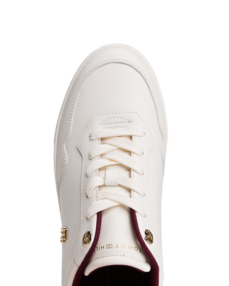 showcasing the padded tongue, soft lining, and Tommy Hilfiger branding on the insole.