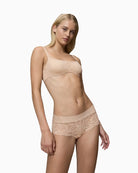 Nude beige Triumph shorty styled with matching Illusion Lace bra