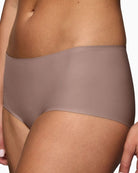 Close-up view of Triumph chocolate brown shorts with second-skin fit and no VPL