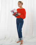 Side view of TWNS V-neck sweater showing flattering fit