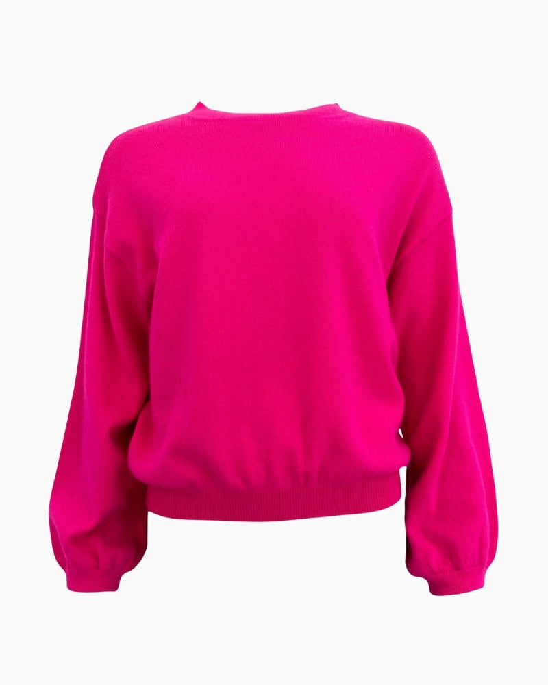 Front view of TWNS Colorado knit in neon pink with puff sleeves