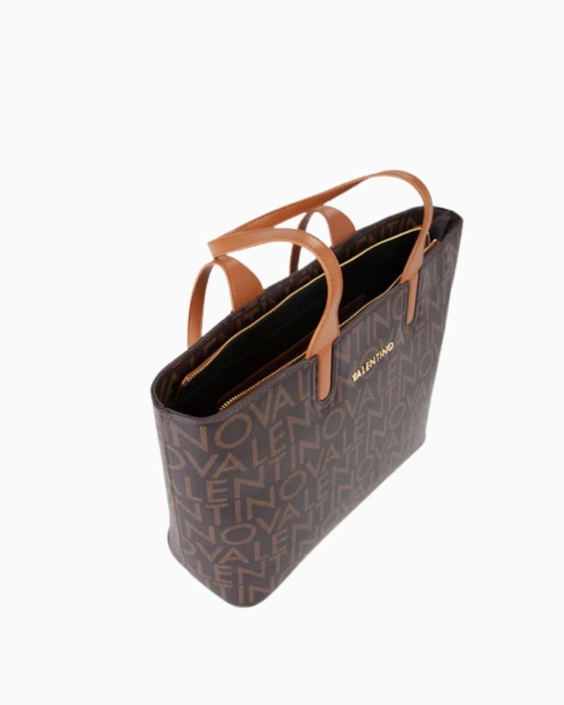 Close-up of jacquard logo strap and soft nappa-style trim on Regina tote