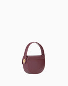 Back view of  Wannabe Re Pattina bag with gold logo and structured flap