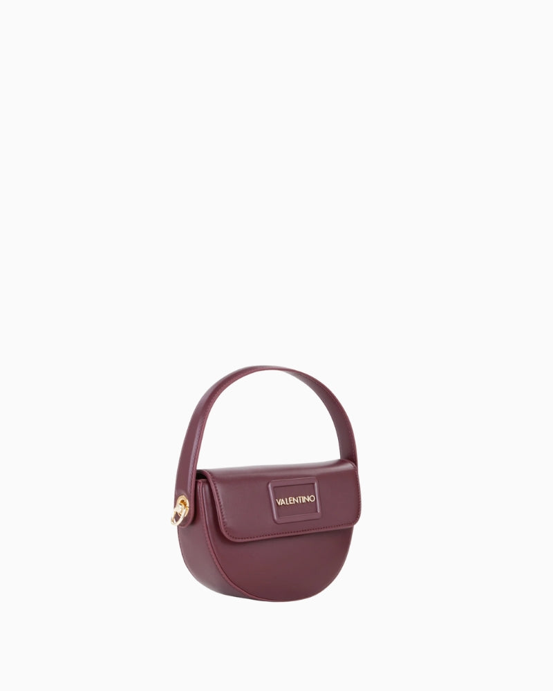 Side view showing depth and compact design of crossbody bag