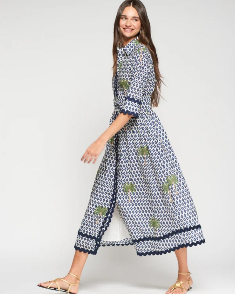 Woman wearing Vilagallo palm print shirt dress blue and white model view – Áines Boutique