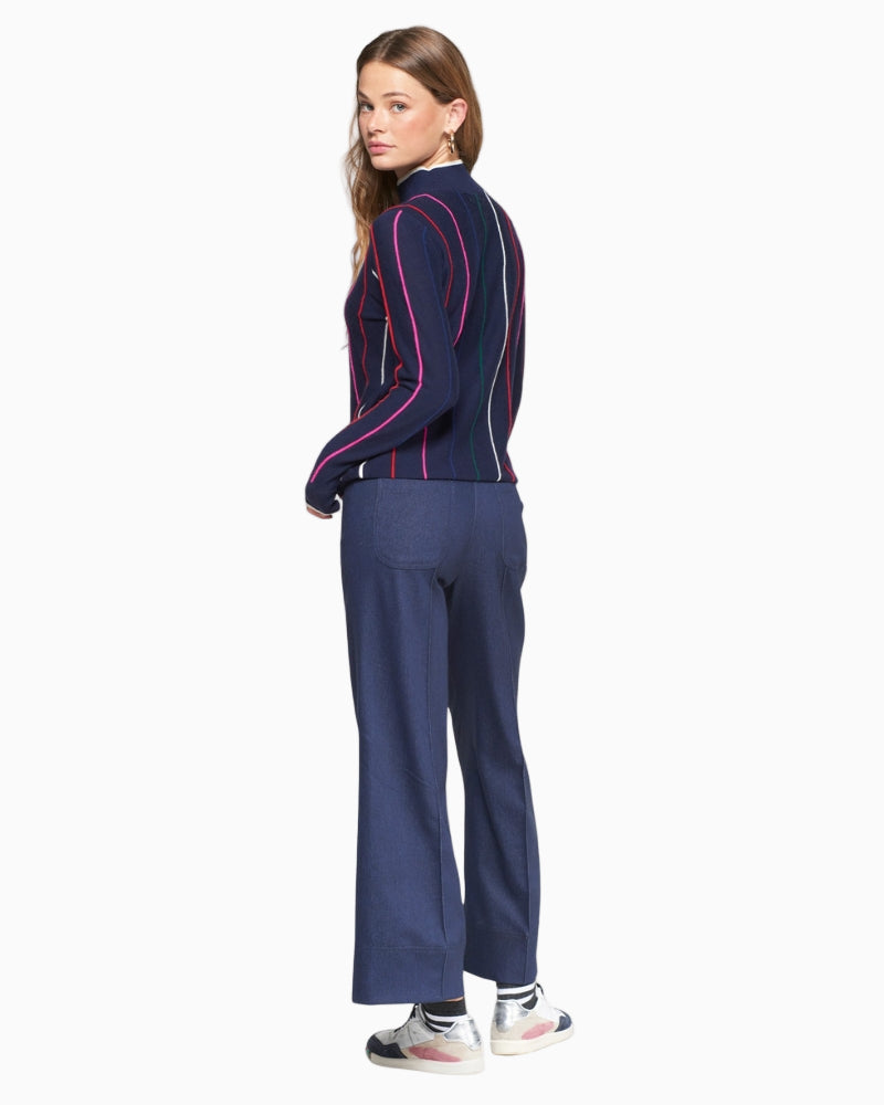Model wearing Vilagallo Bettina dark blue denim trousers, back view