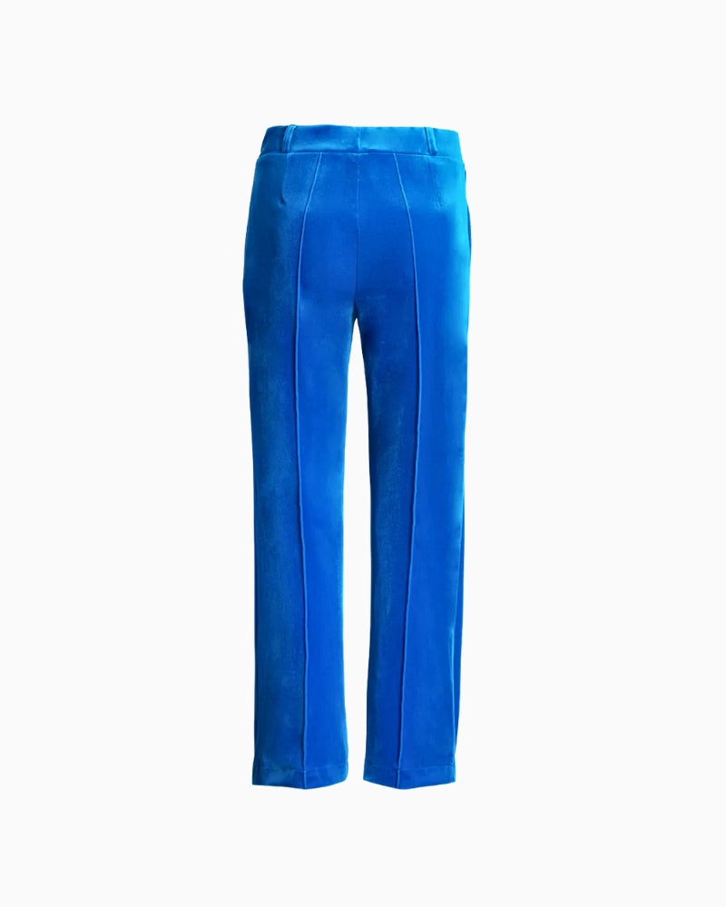 Back view of vibrant turquoise velvet trousers