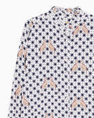 Close-up of leopard and star illustration on viscose fabric