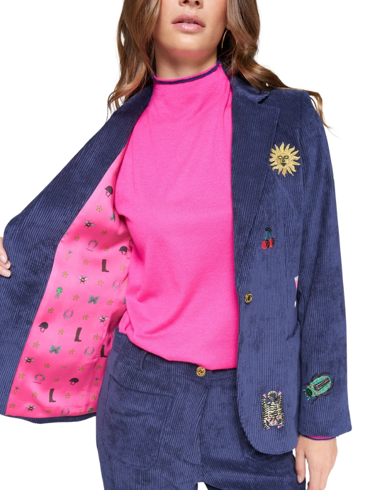 Interior lining detail showing fuchsia printed fabric of Vilagallo blazer