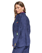 Back view of navy corduroy blazer showing straight cut and embroidered details