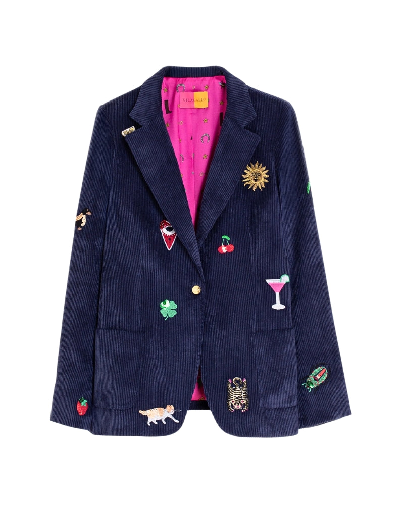 Close-up of playful embroidered motifs on Vilagallo navy blazer