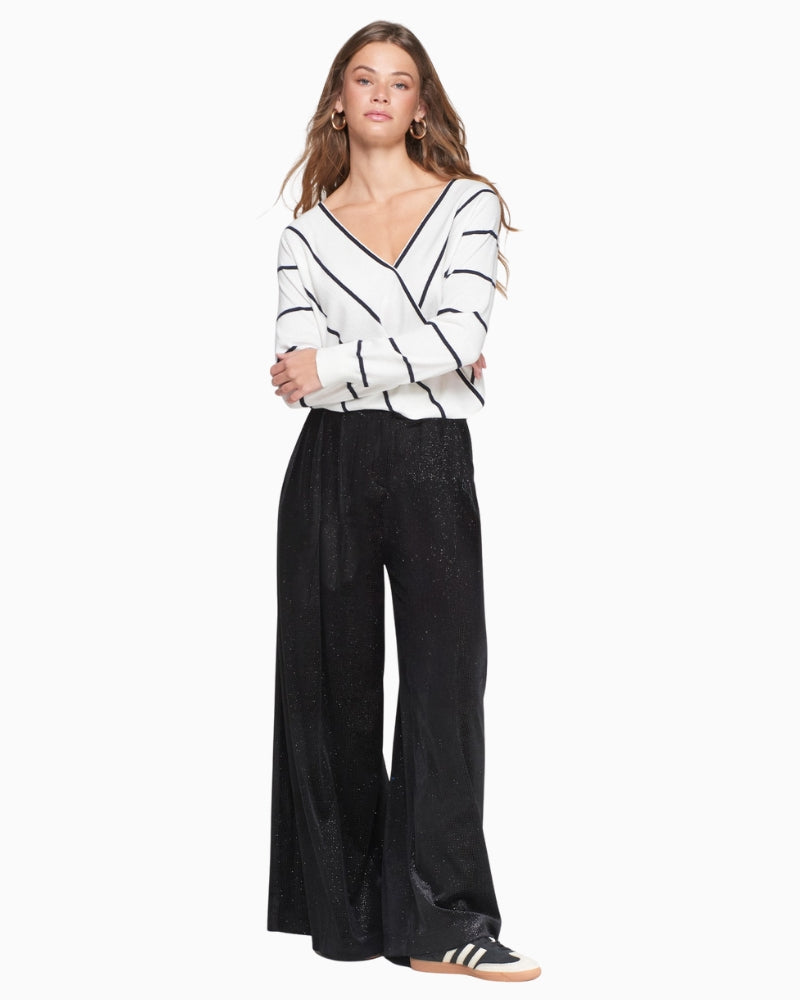 Front view of Vilagallo black shimmer velvet palazzo trousers