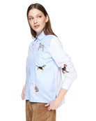 Sleeve detail of blue striped Vilagallo shirt with embroidered dog design