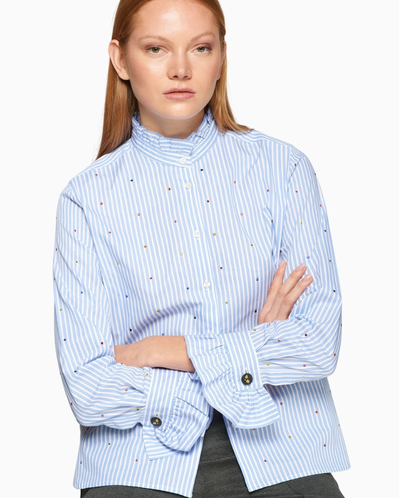 Close-up of frilled collar and ruffle cuff details on Vilagallo shirt