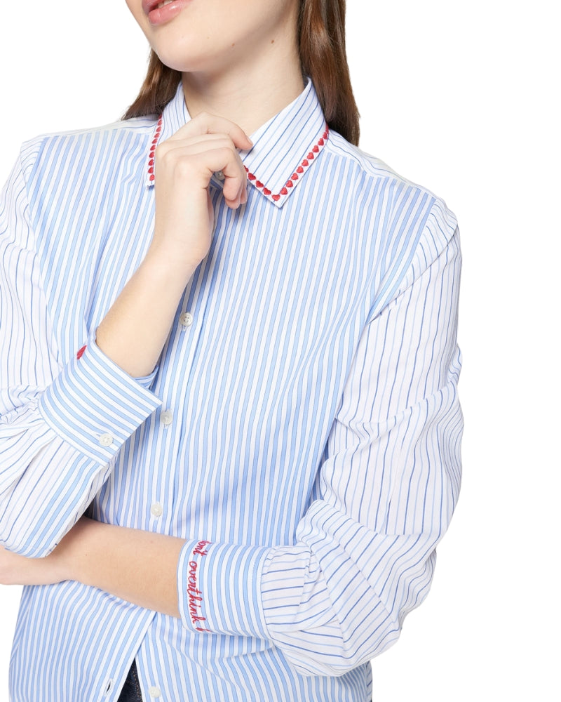 Close-up of embroidered hearts and cuff message on Vilagallo shirt