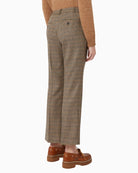 Back of wool check trousers showing welt pockets and cropped length
