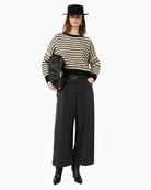 Ezor cropped wool jumper styled with high-waisted trousers for a modern winter look